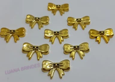 Aplique Laço de ABS Dourado com furo - pct c/12 unid
