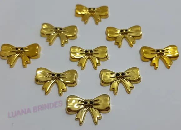 Aplique Laço de ABS Dourado com furo - pct c/12 unid